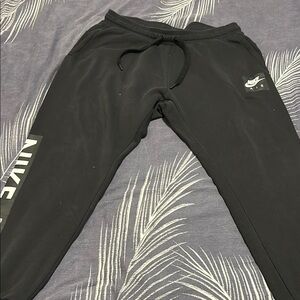 Nike Black Sweatpants with Tapered Fit and Elastic Cuffs